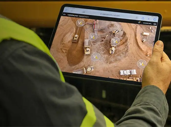 Fleet manager using tablet on construction site